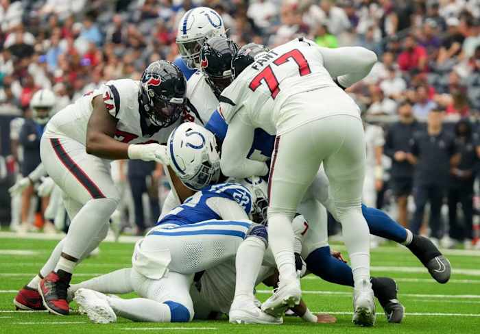 Indianapolis Colts defensive end Samson Ebukam (52) tackles Houston Texans quarterback C.J. Stroud (7) on Sunday, Sept. 17, 2023, during a game against the Houston Texans at NRG Stadium in Houston